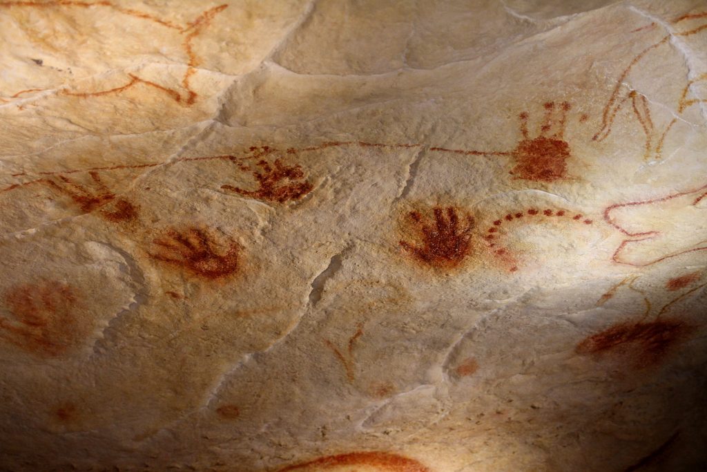 Image of cave wall with ancient handprints