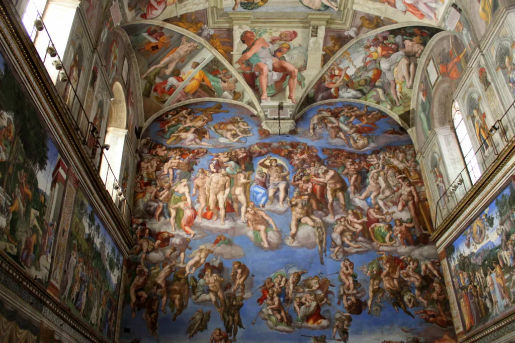 Interior of Sistine Chapel showing artwork on walls and ceiling