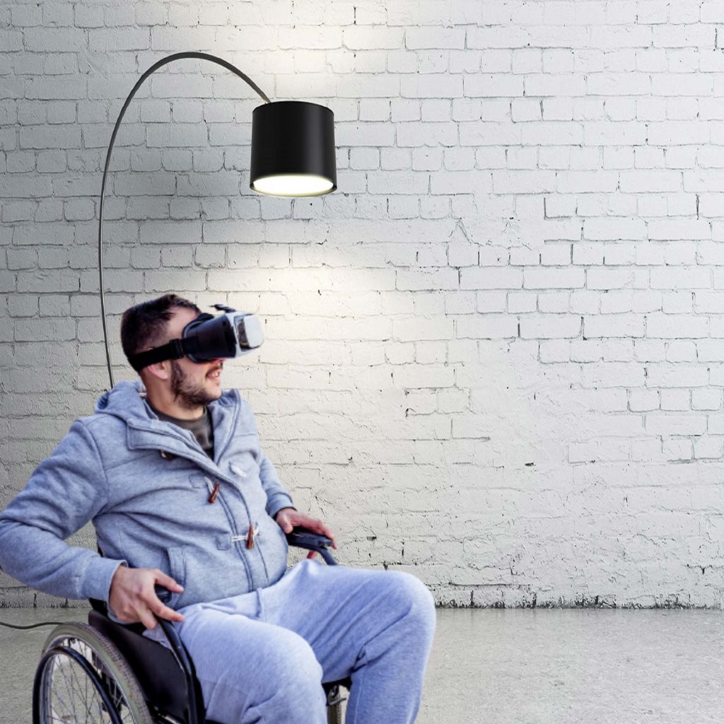 Man in wheelchair wearing VR headset