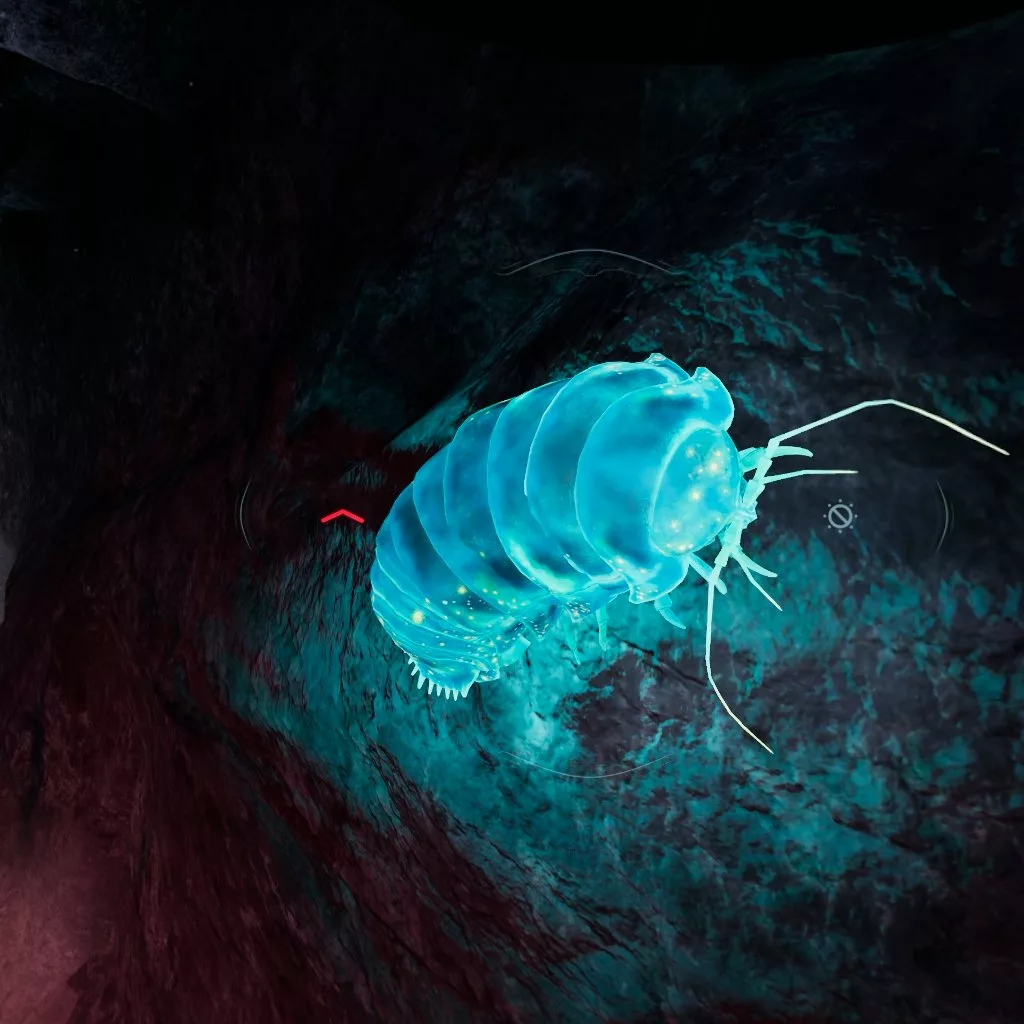 A large glowing beetle-like creature, possibly an isopod.
